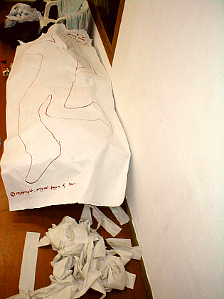 body outline on the bed