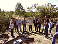 the dignitaries standing around one of the opening of the latrine